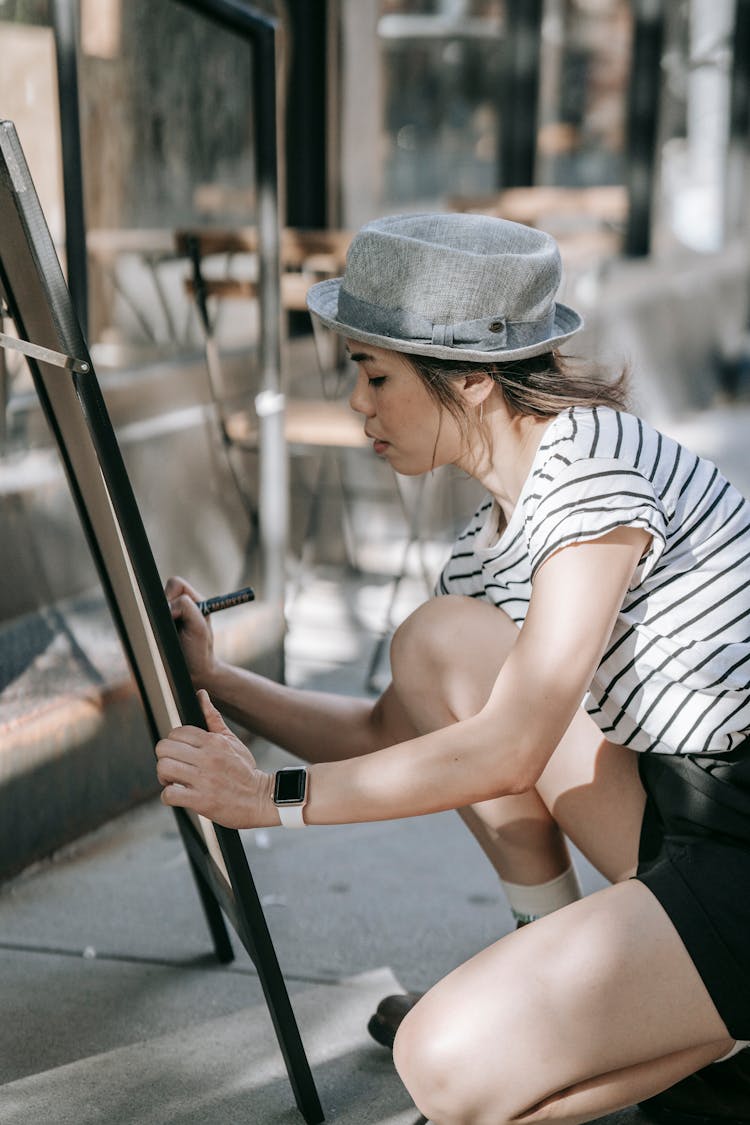 Woman Writing On The Board 