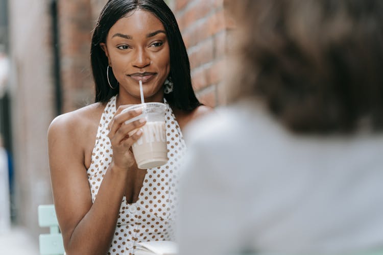 Smiling Woman Holding A Drink 