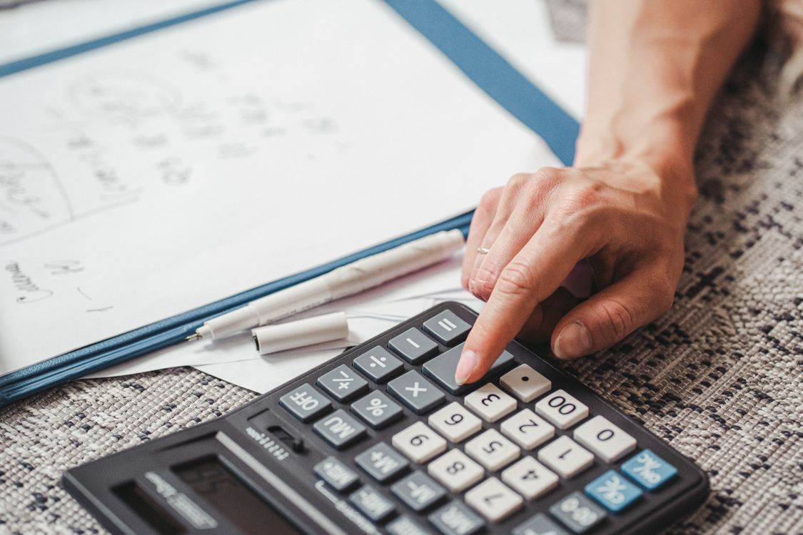 Calculator User A Person using a Calculator · Free Stock Photo