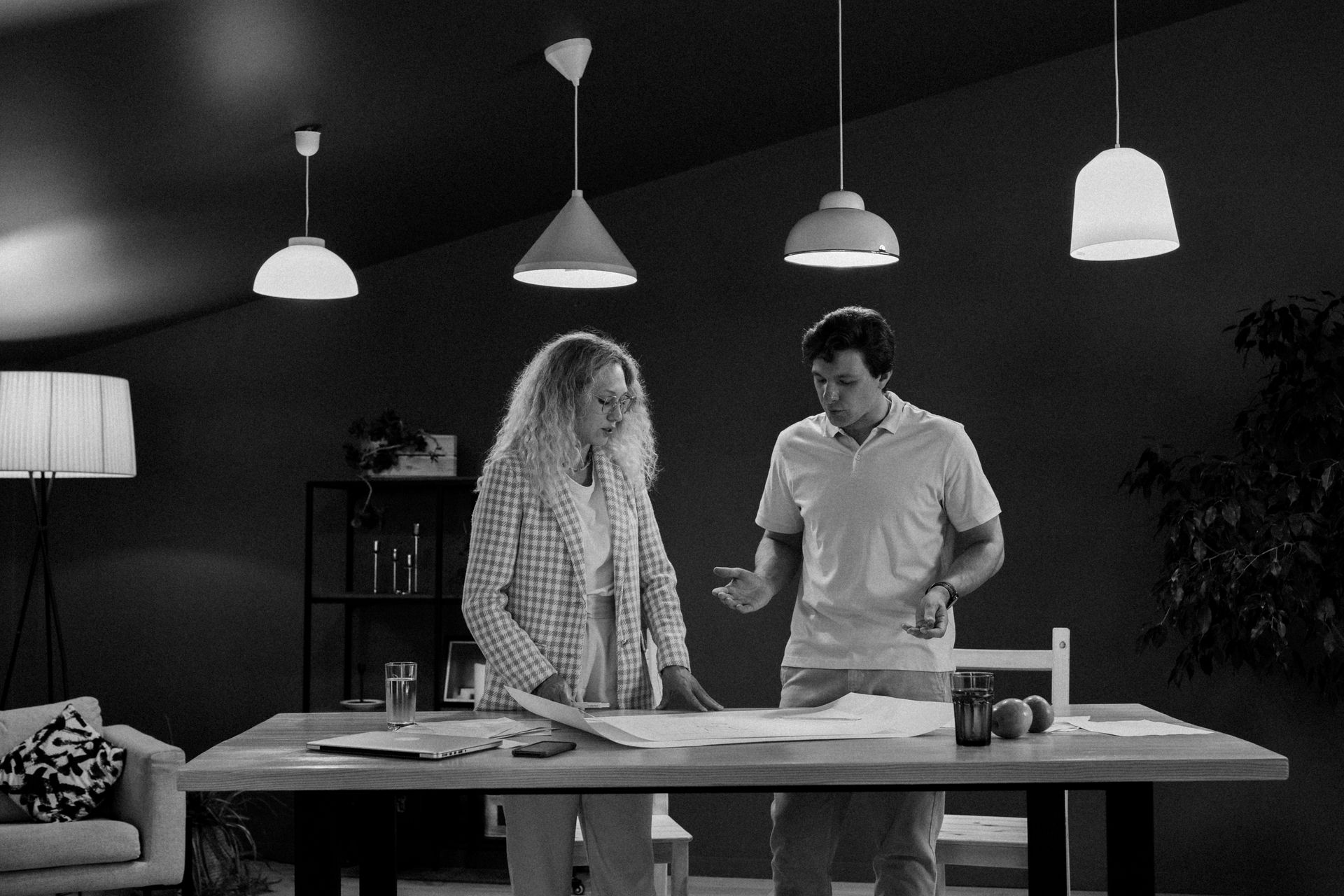 Colleagues engaged in a brainstorming session at a contemporary workplace setting.