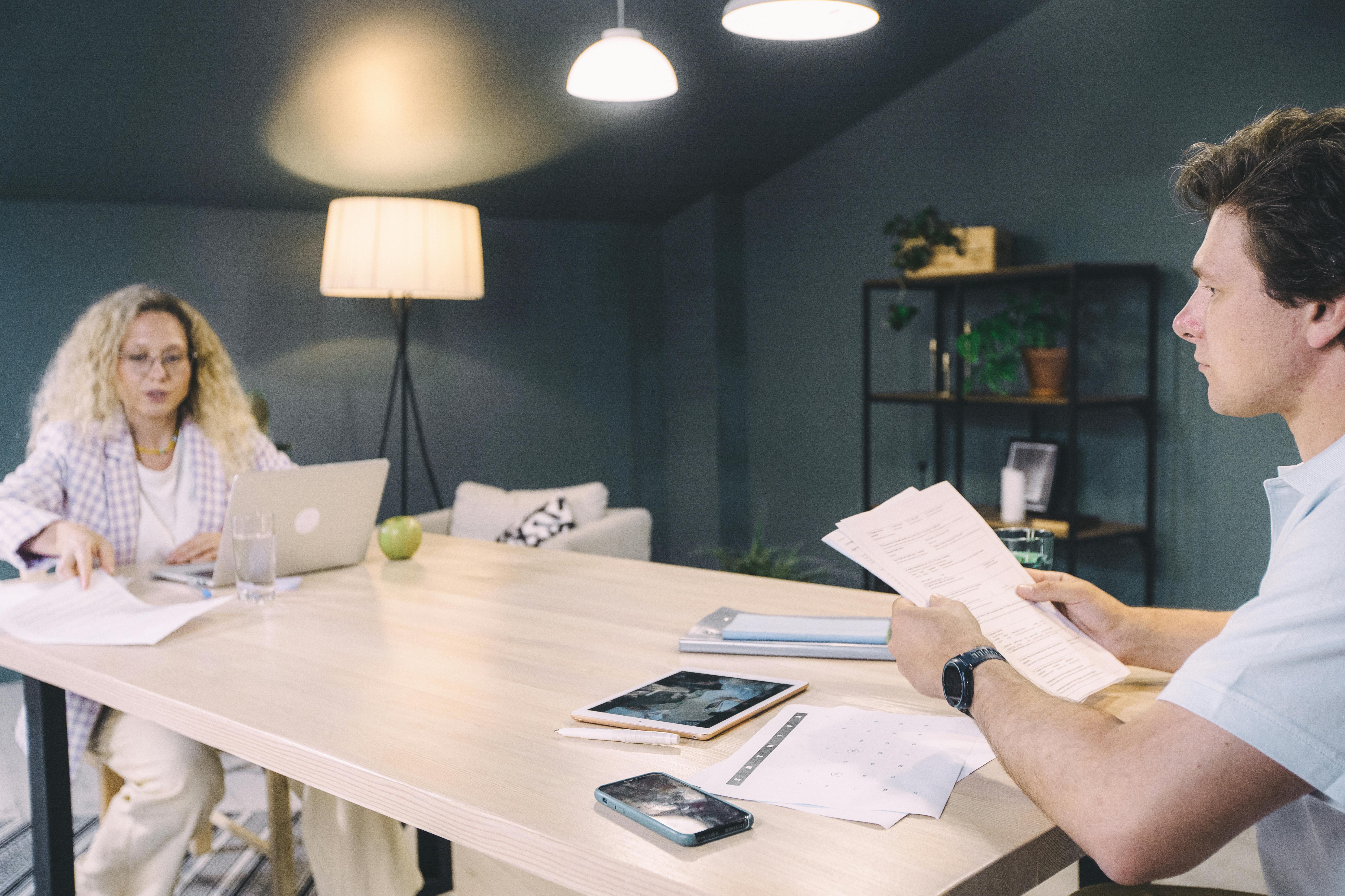 Free Person Holding White Printer Paper Stock Photo