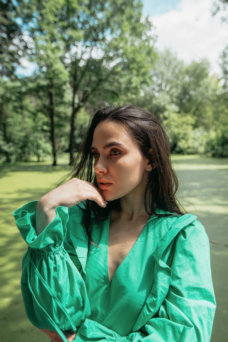 Woman In The Forest Wearing Green Long Sleeves 