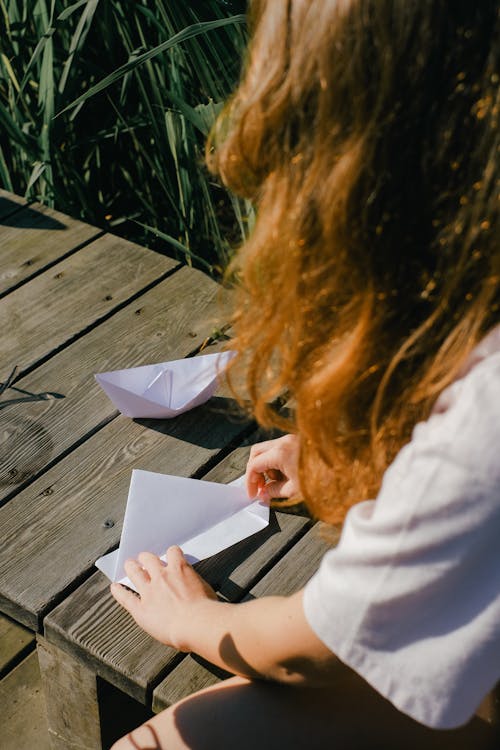 A Person Making Paper Boats