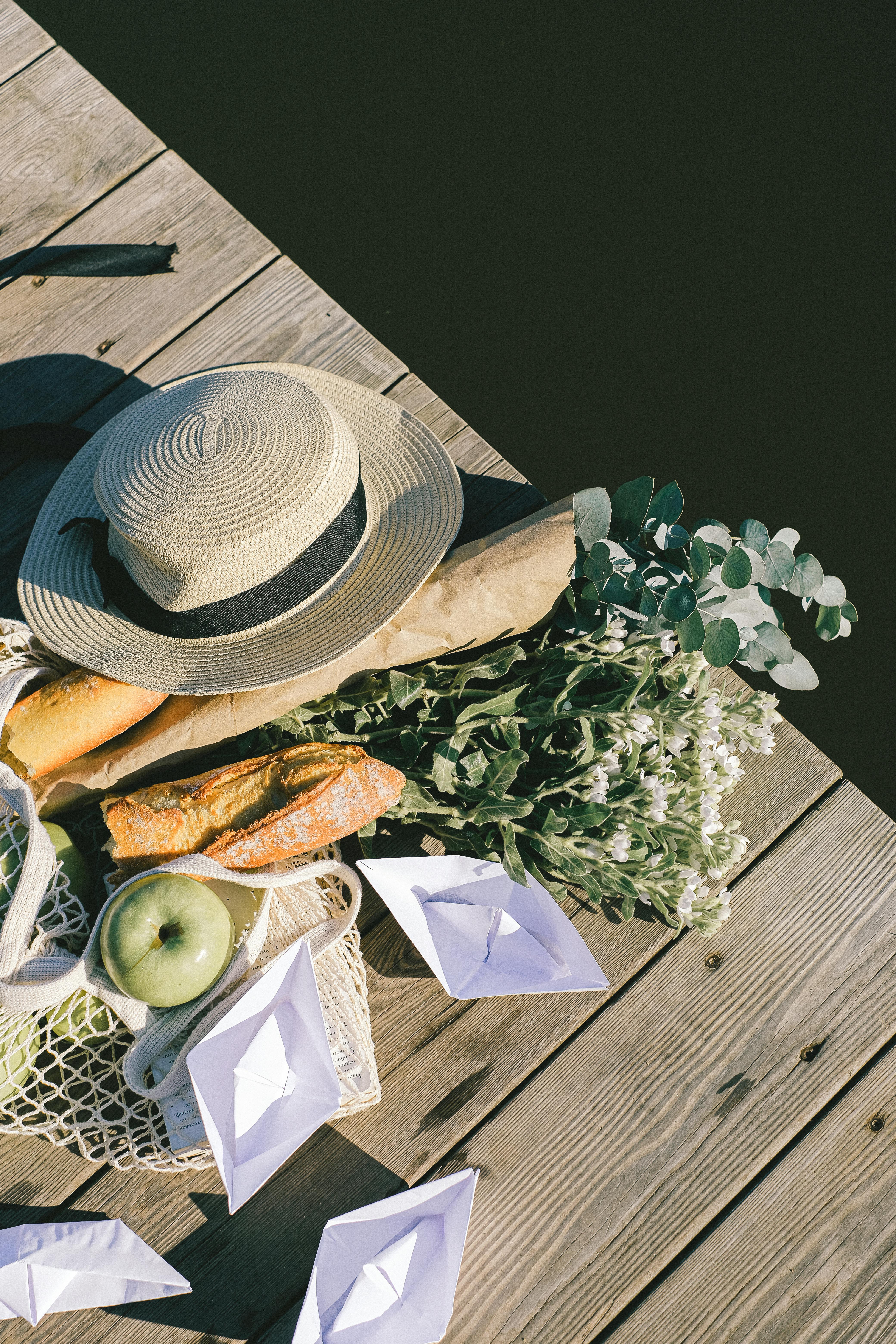 brown hat on wooden dock