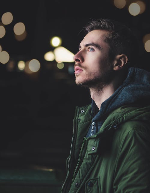 Man Wearing Green Zip Jacket