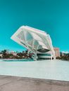 White Concrete Building Near Body of Water