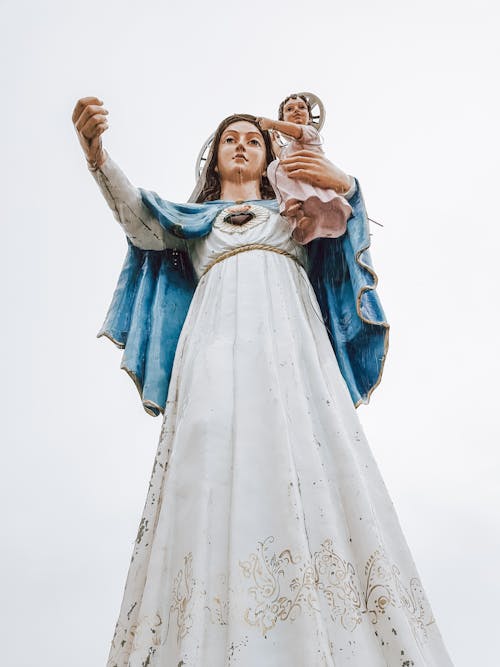 Free A Woman in White and Blue Dress Statue Stock Photo