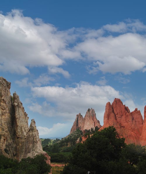 Brown Rocky Mountain Under White Clouds