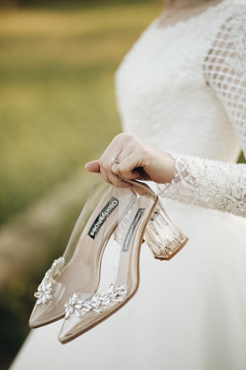 Free A Bride Holding her Wedding Shoes Stock Photo