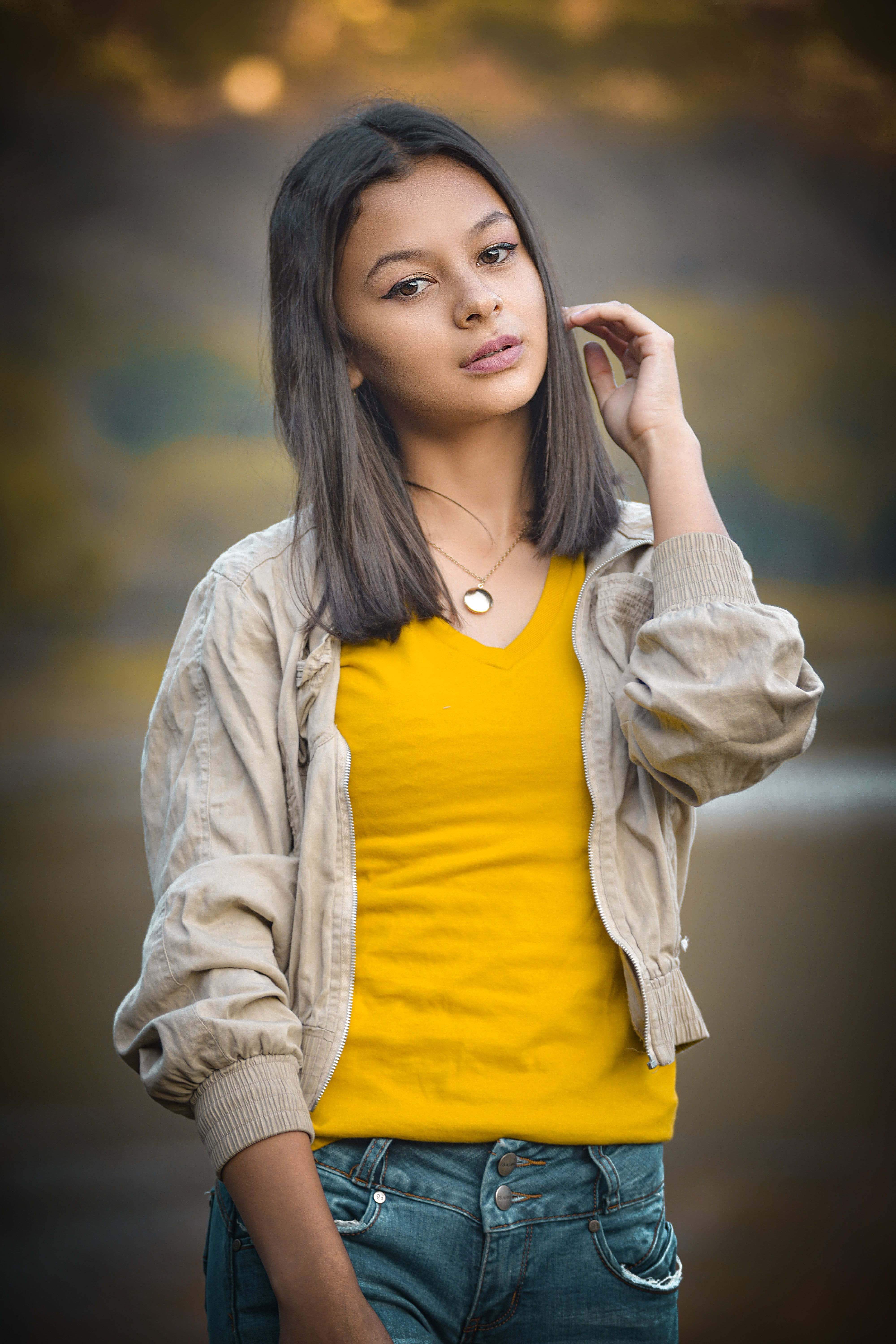 A Girl in Yellow Shirt and Brown Jacket · Free Stock Photo