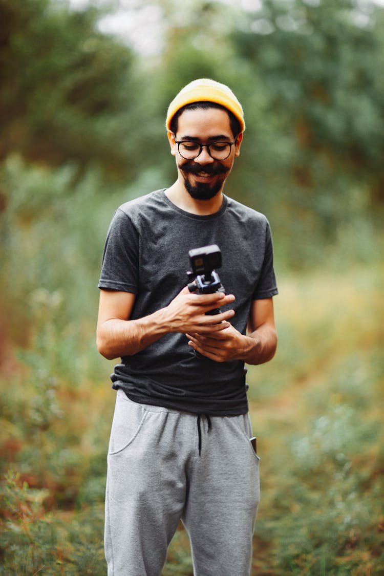 A Man Holding A GoPro Camera