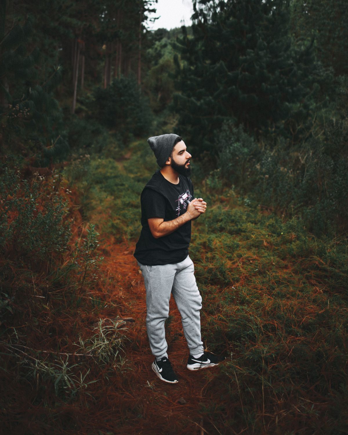 A Man in Black T-shirt Standing on Brown Grass · Free Stock Photo