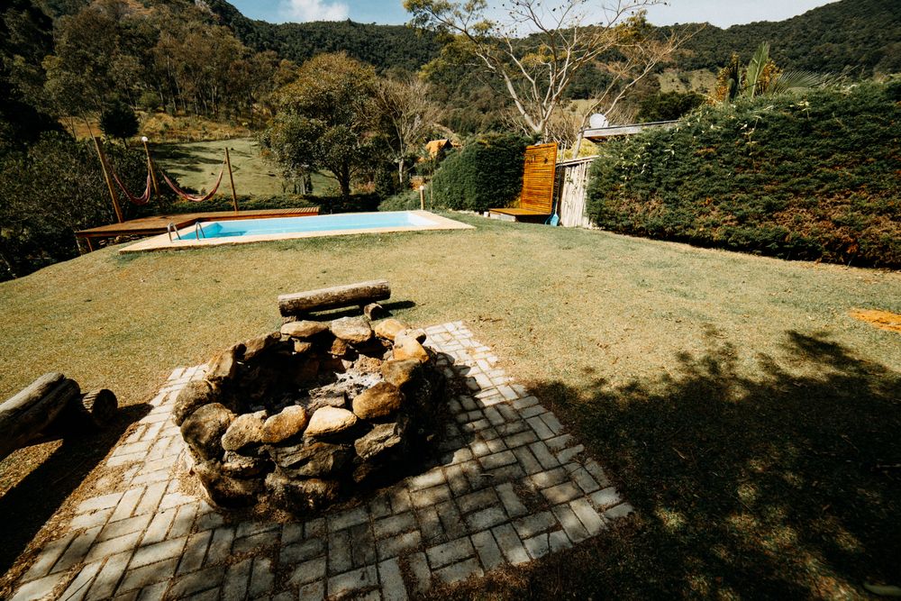 Outdoor pool area featuring natural stone surroundings