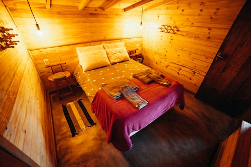 A Wooden Wall Inside the Bedroom