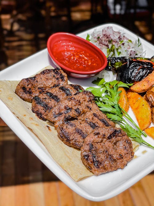 Grilled Meat With Vegetable on a White Ceramic Plate