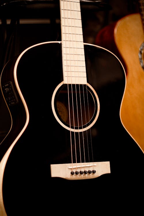 A Black and White Acoustic Guitar