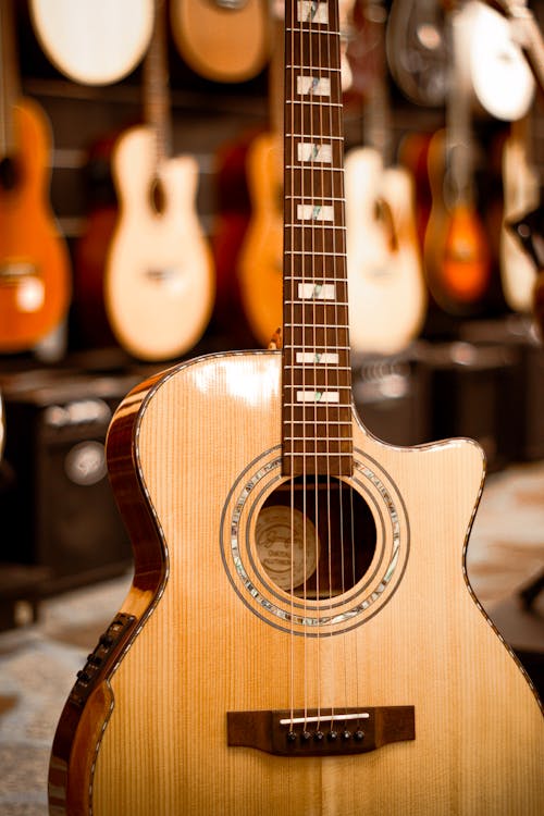 Free Shallow Focus Photo of Brown Acoustic Guitar Stock Photo