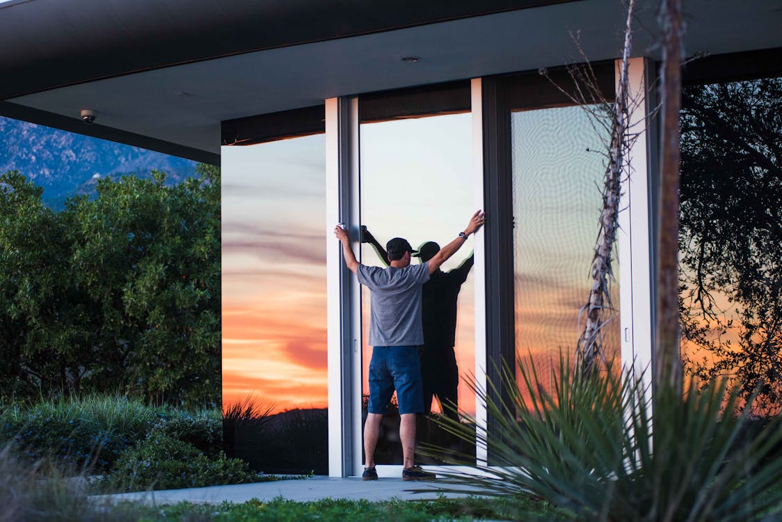 Free Person in Gray Shirt and Blue Shorts Standing during Dawn Stock Photo
