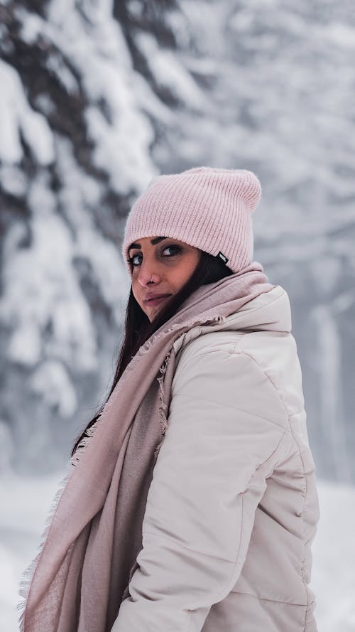 Woman Wearing Pink Beanie and Bomber Jacket