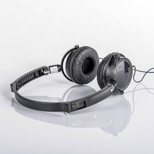 Folding on-ear headphones with a coiled cable — photo by Saeed Khokhar on Pexels