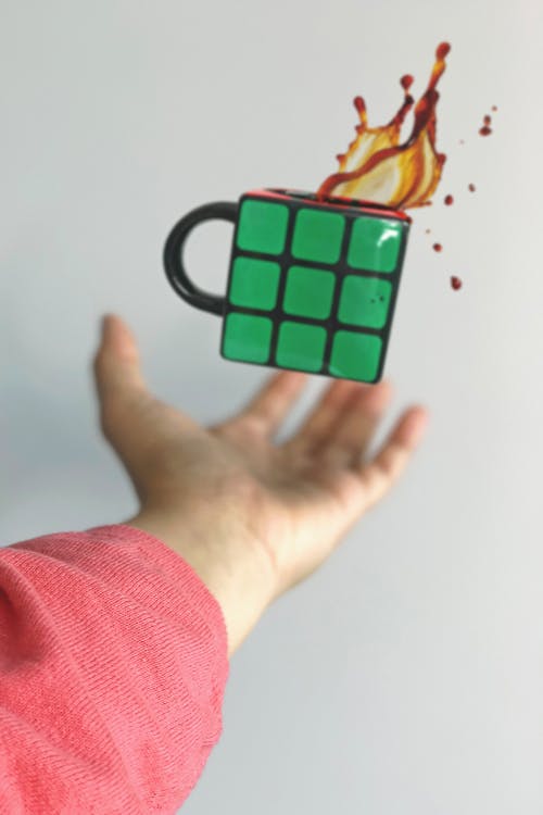 Free Green and Black Coffee Mug on Air Stock Photo