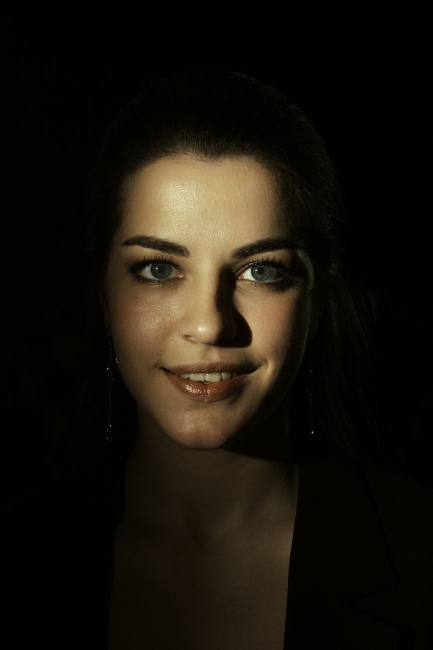 Portrait of a woman with striking lighting creating a dramatic effect, highlighting her features.. pexels, portrait, woman