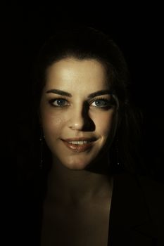 Portrait of a woman with striking lighting creating a dramatic effect, highlighting her features.. pexels, portrait, woman
