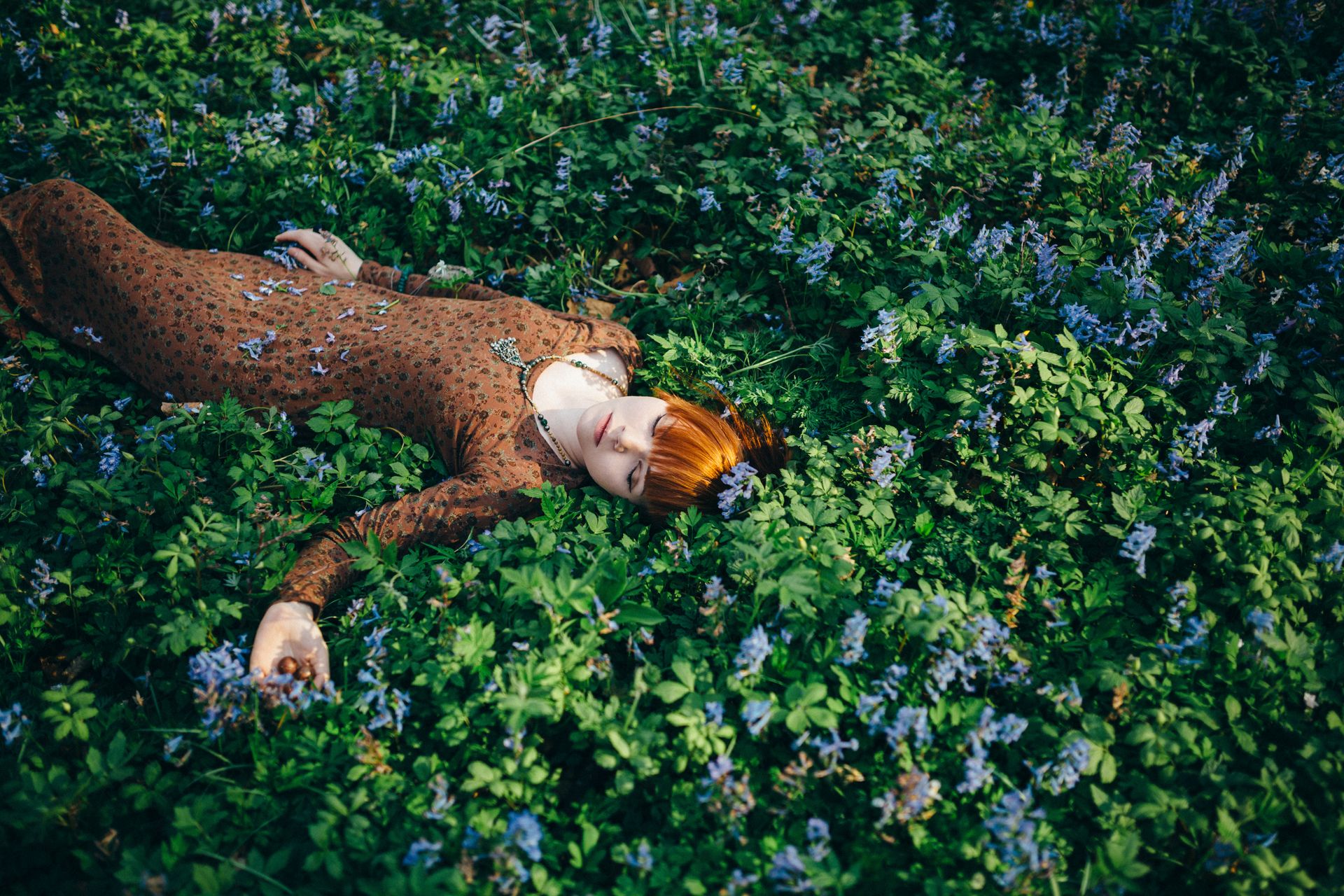 Woman Eyes Closed Lying on Flowering Plants