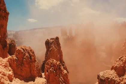 Sandstone cliffs in a desert sandstorm, photo by Noelle Otto on Pexels