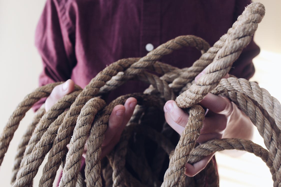 A Roll Of Thick Strong Rope And The End Of A Man's Hand. Close-up. Stock  Photo, Picture and Royalty Free Image. Image 23721532.