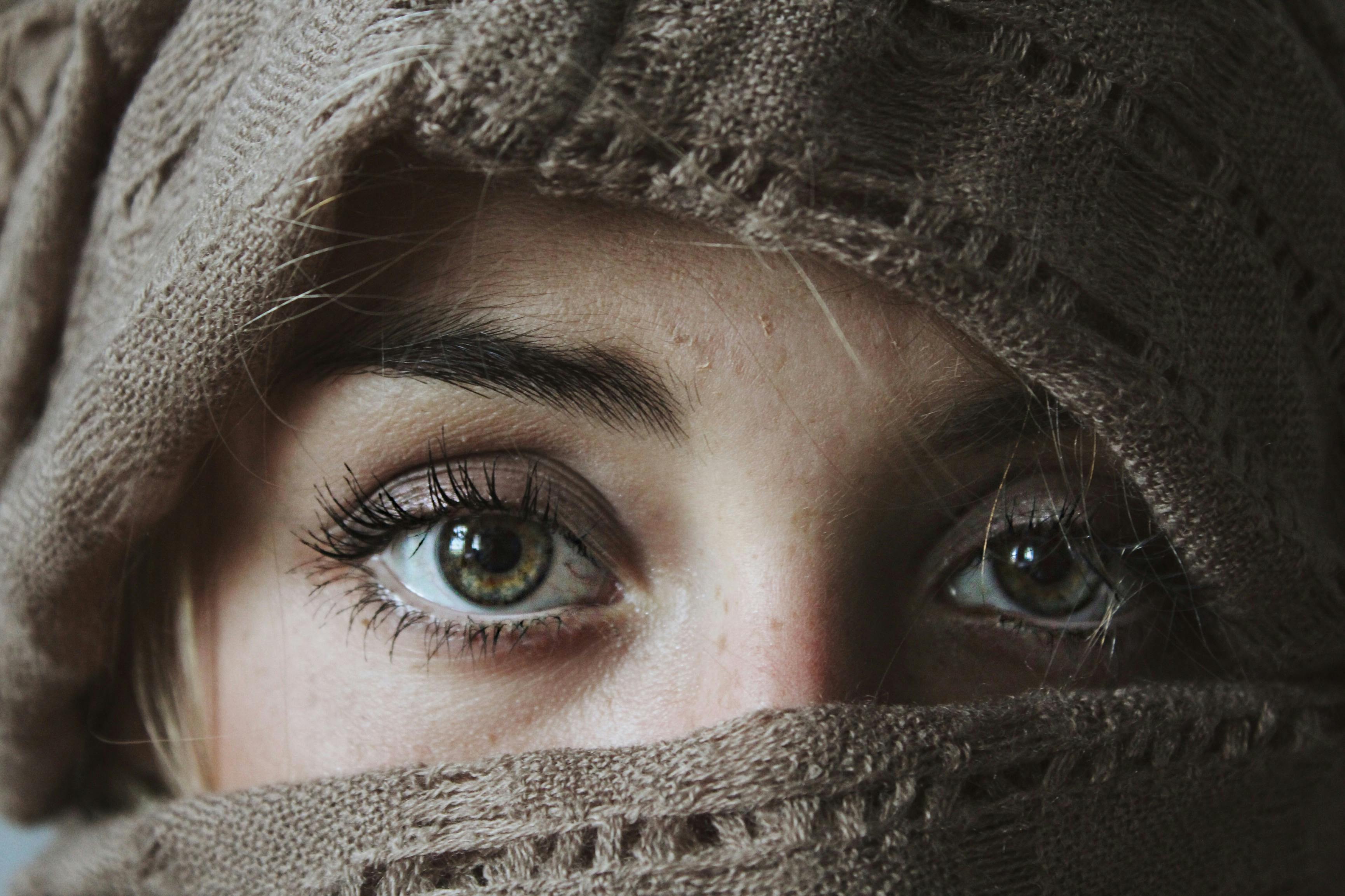 photo of person covered with brown textile