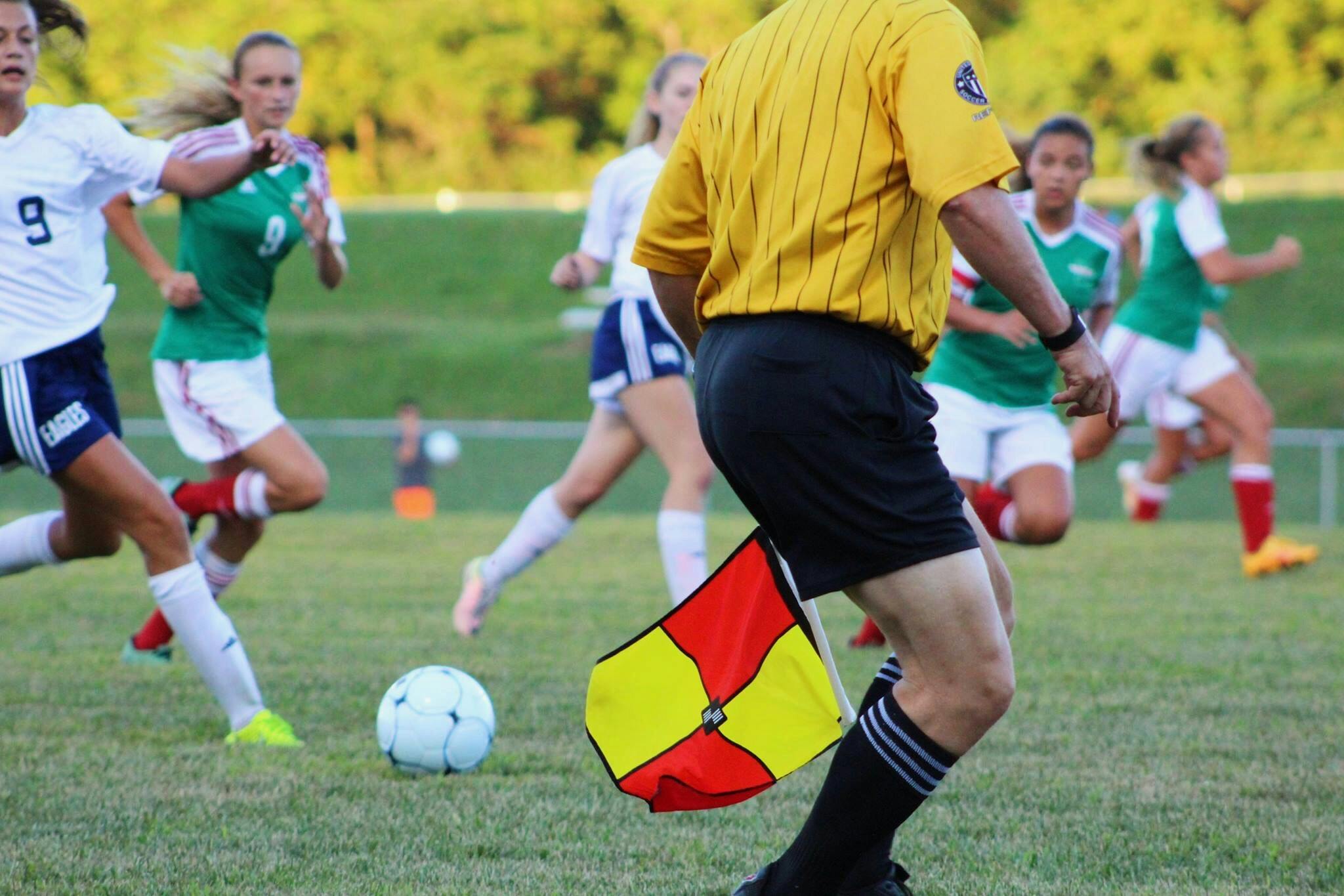 woman athletes playing soccer