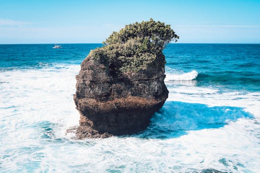 Breathtaking ocean view with a majestic rock formation off Davao coast. Perfect for nature enthusiasts.