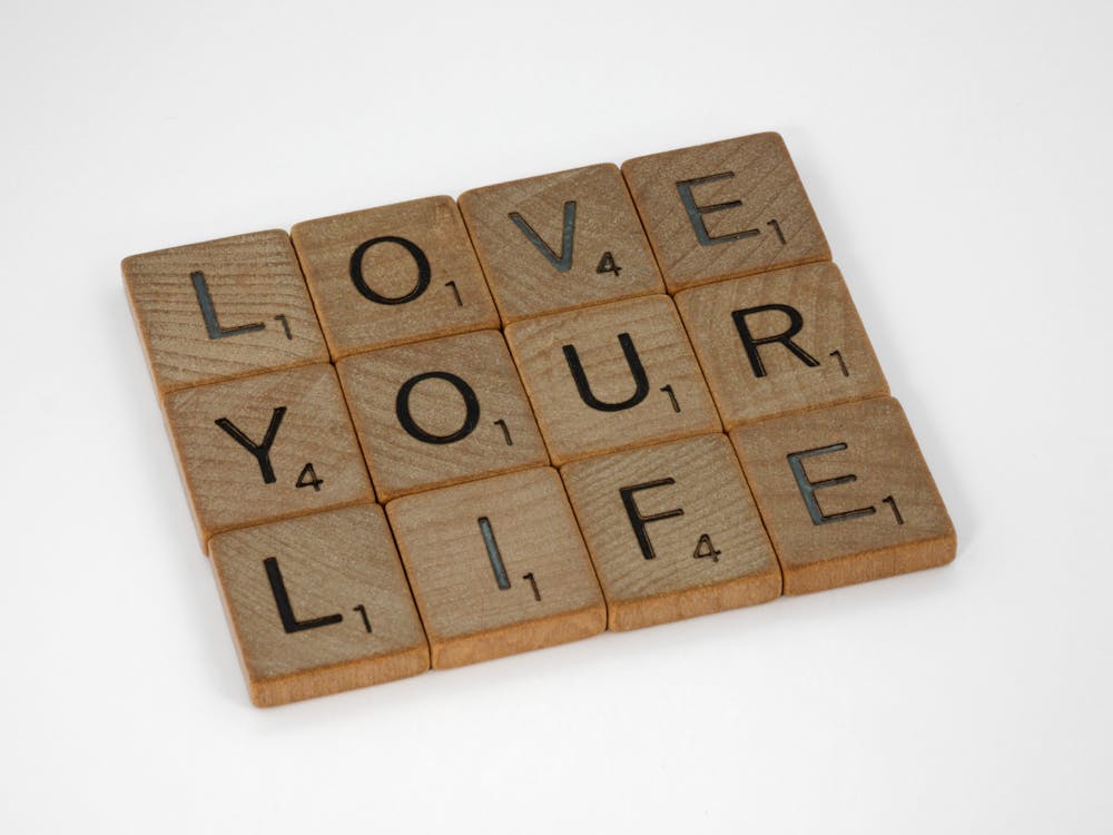 Free Love Your Life Text on White Background Stock Photo