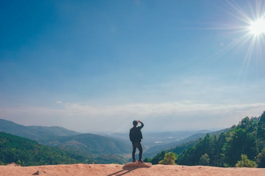 Man Sitting on the Mountain Edge · Free Stock Photo