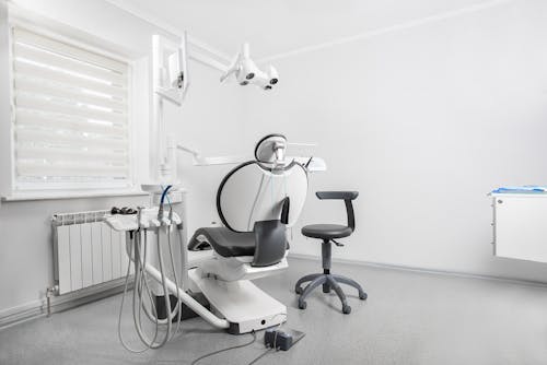 Free Dental Chair Inside a Clinic Stock Photo