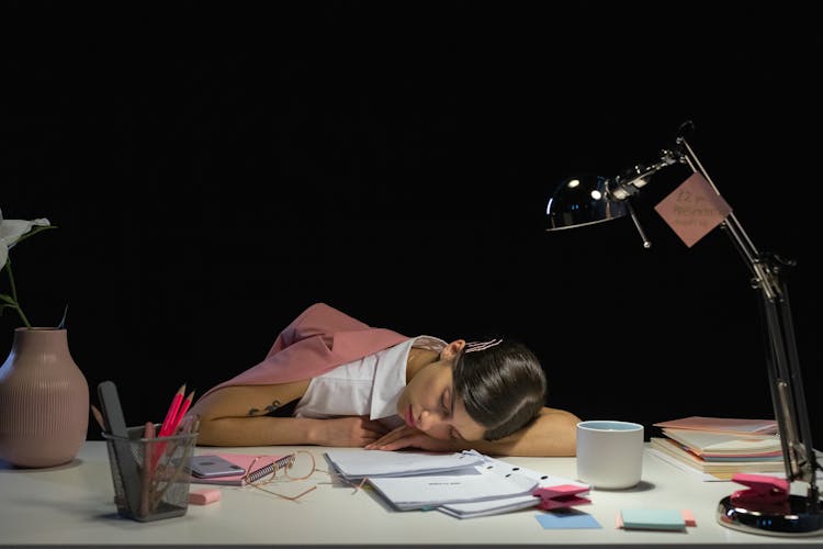 Woman Sleeping On Desk 