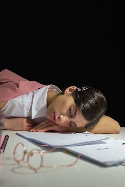 Free Woman Sleeping on the Office Desk Stock Photo