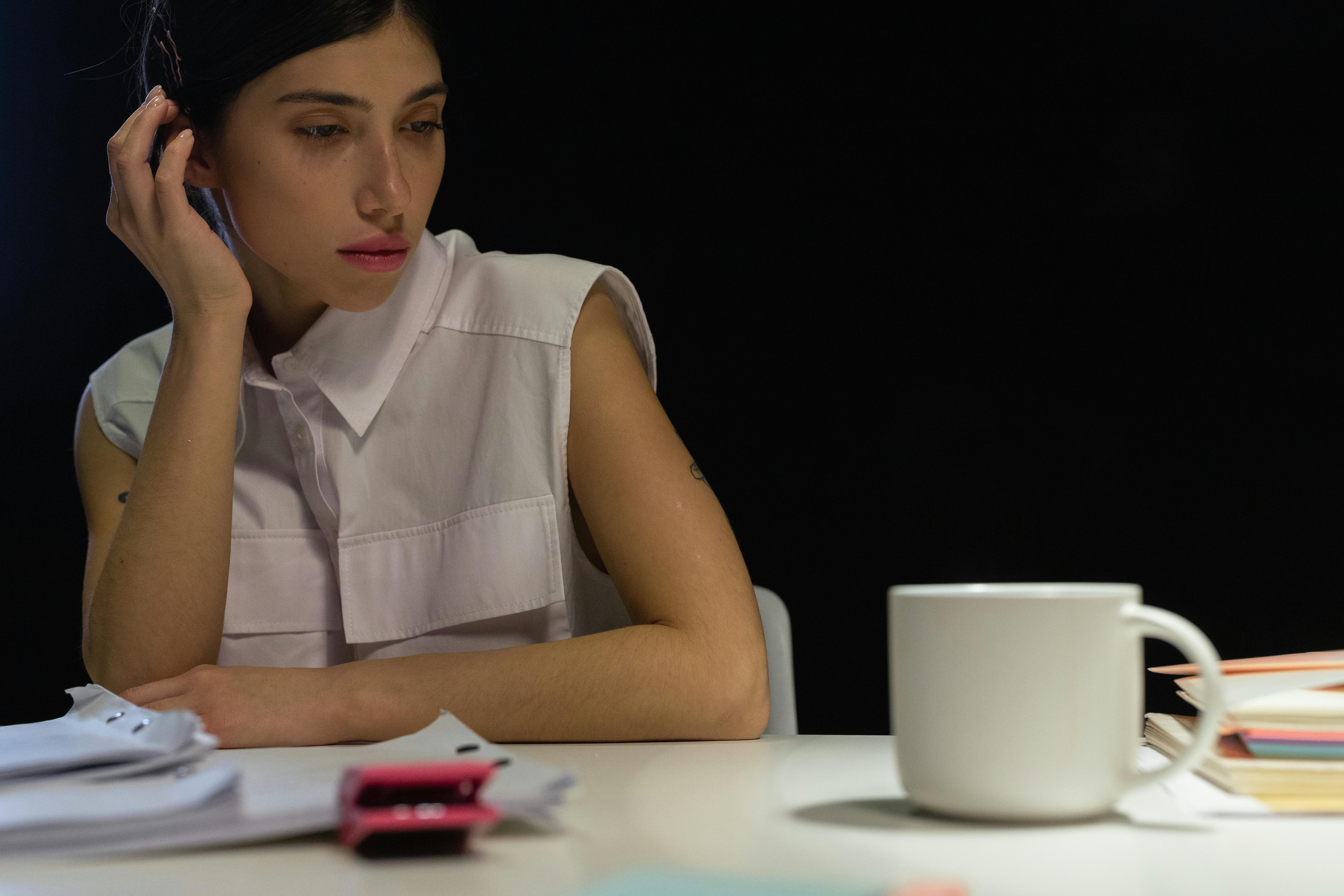 Woman Leaning on Table