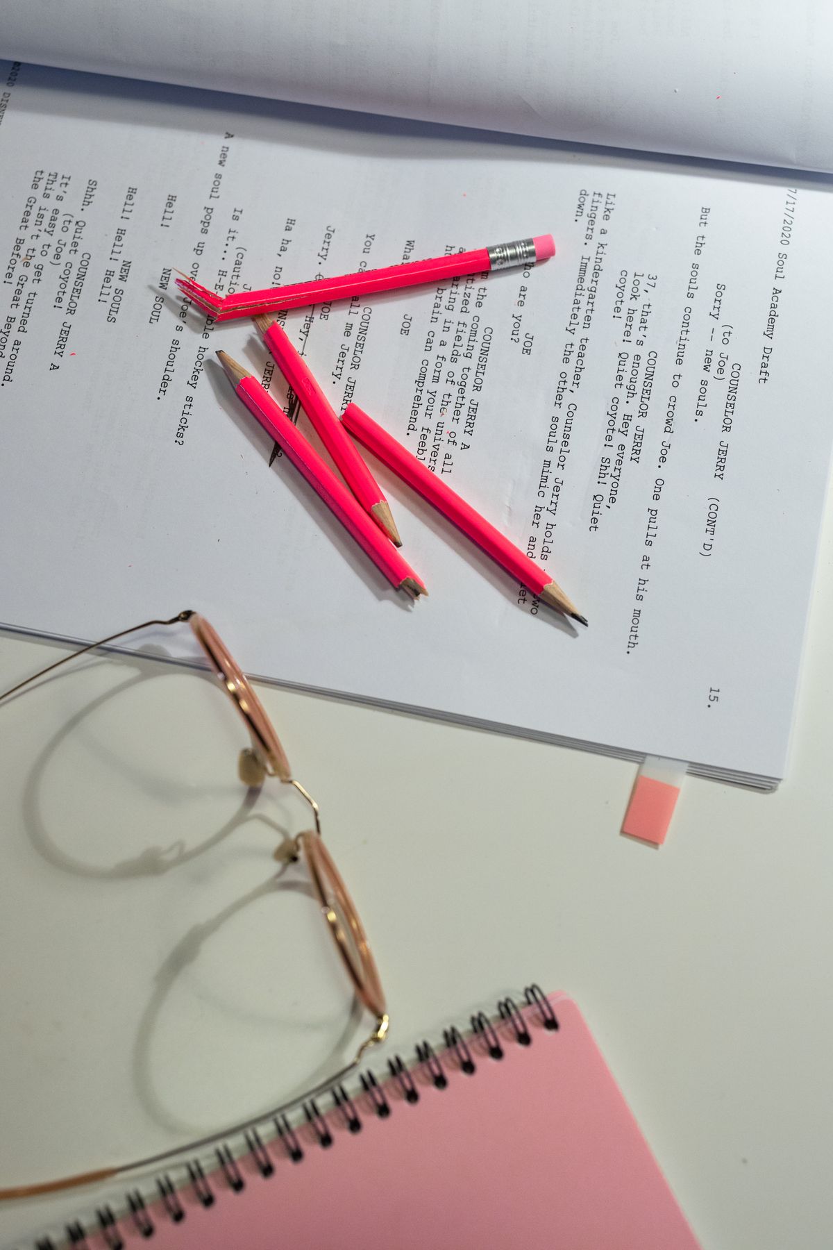 Printed documents and reading glasses on a desk