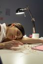 Sleepy Woman Lying on  Desk