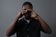 Man with his Hands on his Face