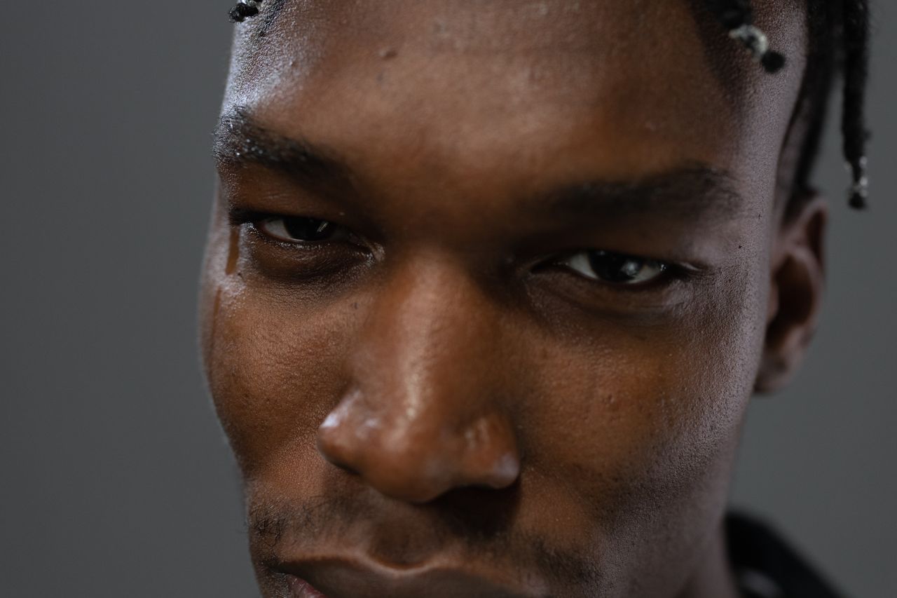 extreme close up portrait featuring intense facial expression and dist