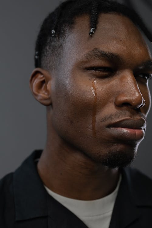 Close-Up Shot of a Man Crying