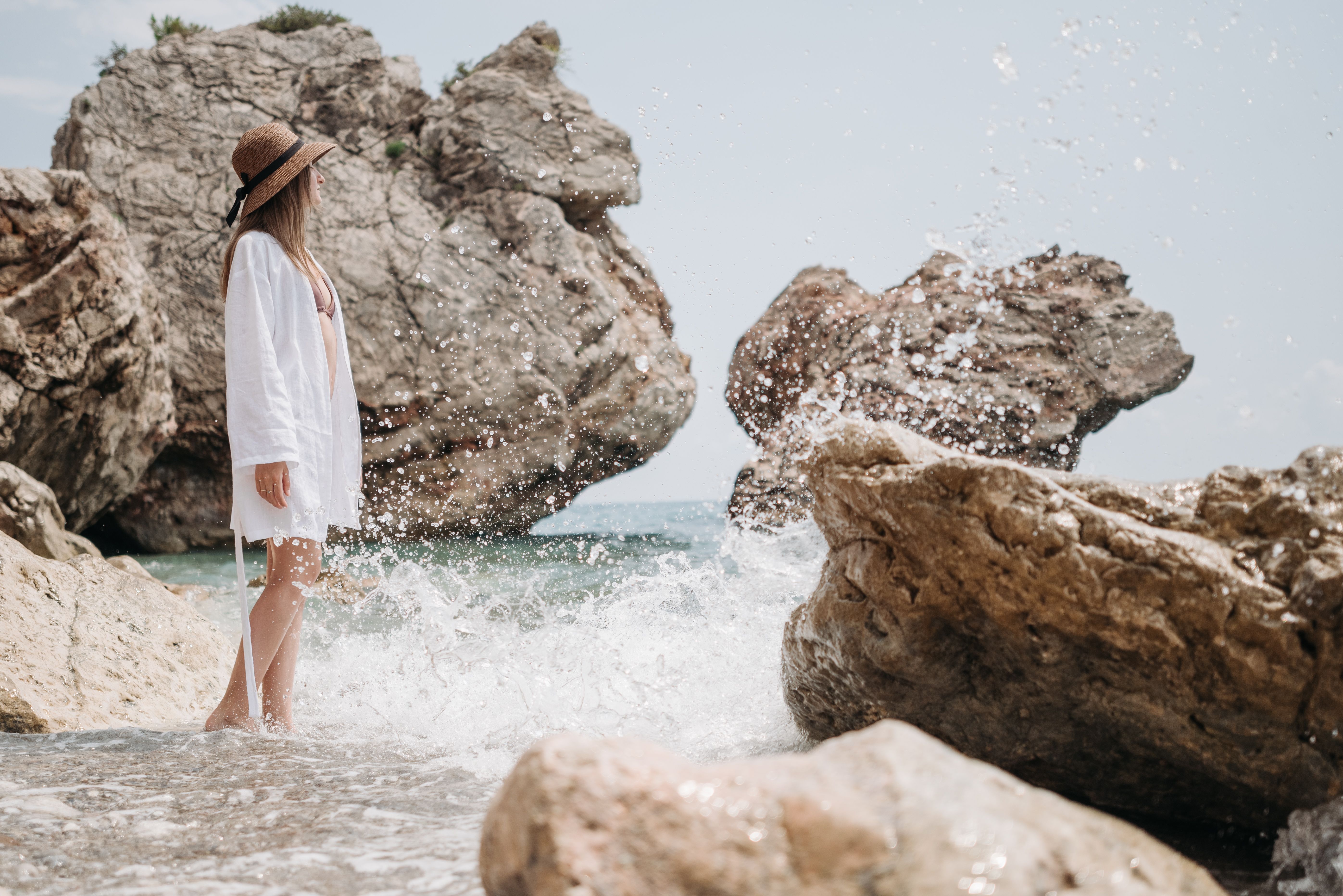 Woman in Swimsuit Standing on Beach Shore · Free Stock Photo