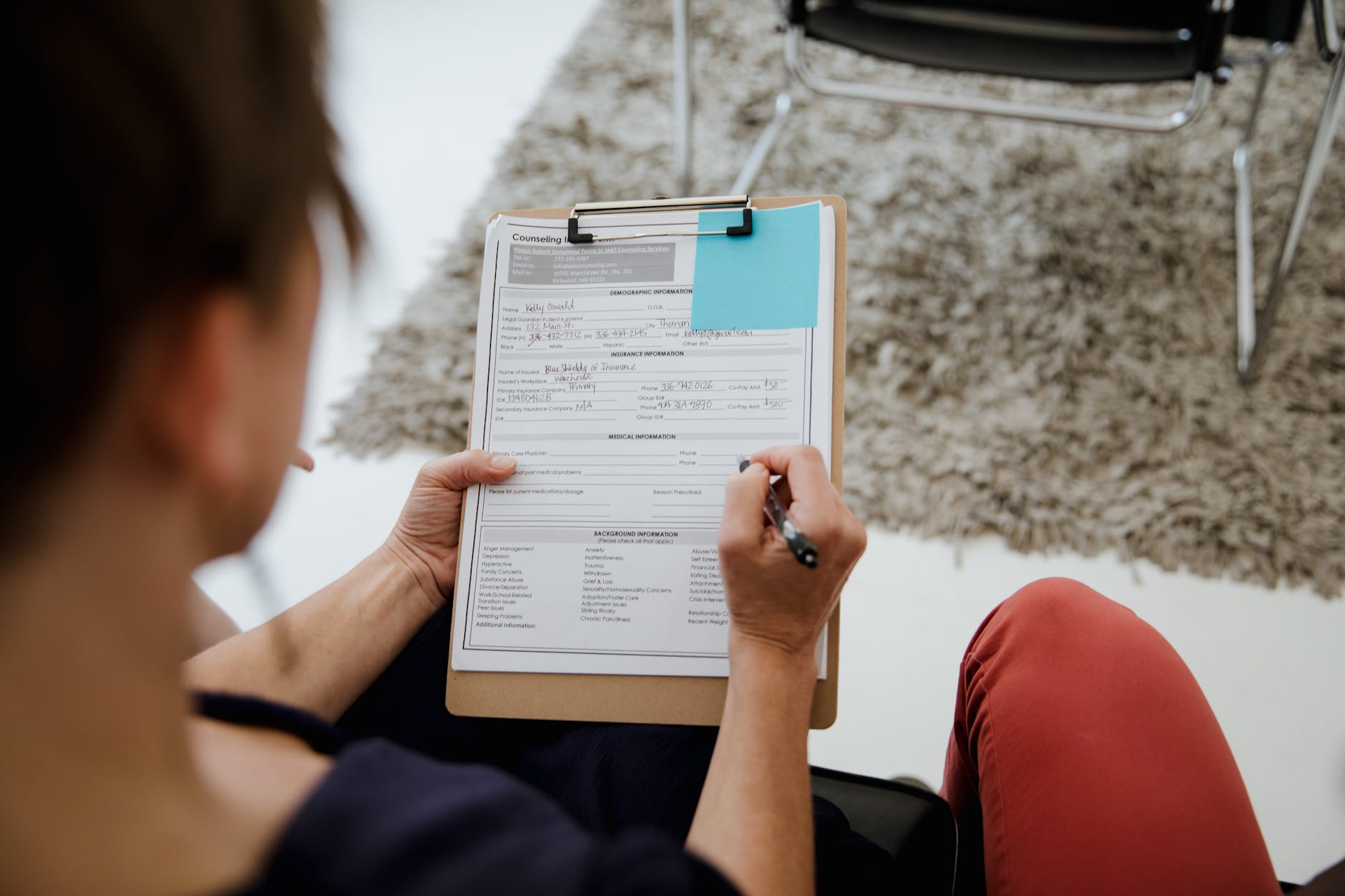 Woman Signing Documents