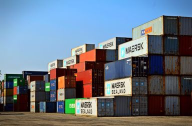Stacked shipping containers in a freight yard