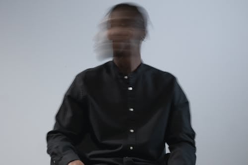 Portrait of Man Wearing Black Shirt in Blur 