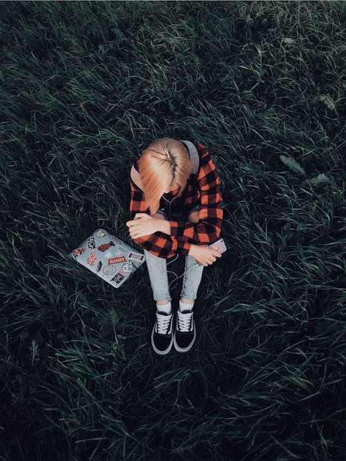 Woman Sitting on Grass