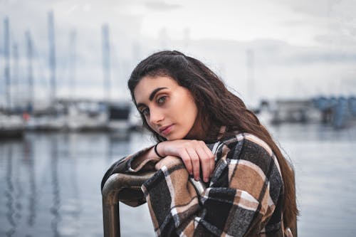 A Woman in Brown and White Plaid Long Sleeves